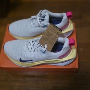 Nike  Running Shoes with Pink, Blue and Yellow Accents, 10 Womens, 8.5 Mens